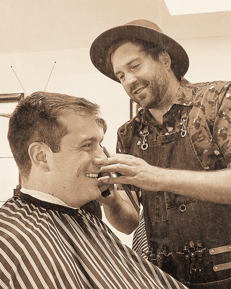 Noel Johnson cutting hair